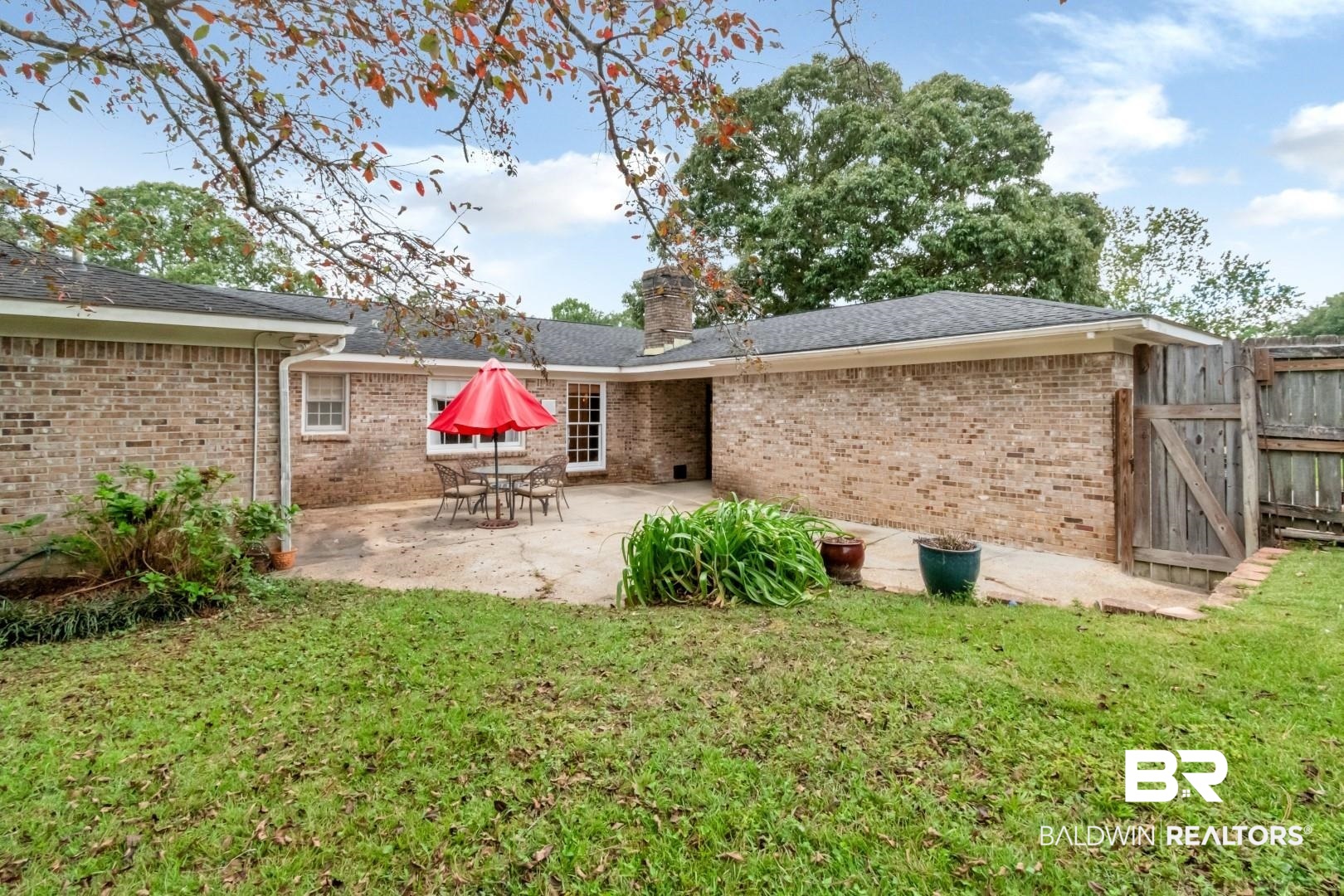 1229 West Chimney Top Drive Mobile, AL 36695 - Photo 32 of 36 Back of house featuring a lawn and a patio area