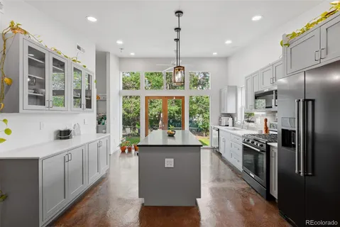 a kitchen with counter top space and stainless steel appliances