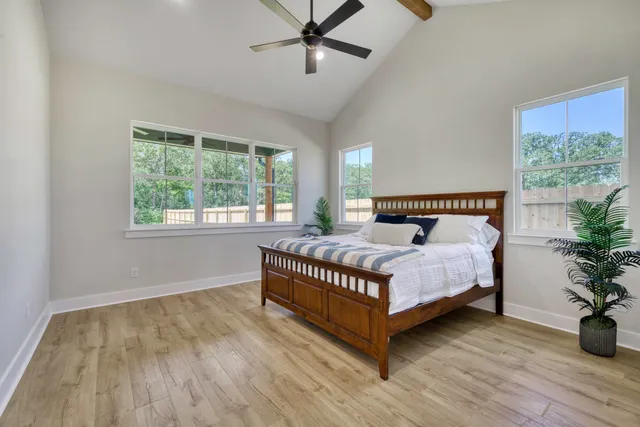 a bedroom with a bed and window