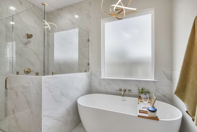 a bath tub sitting next to a white sink