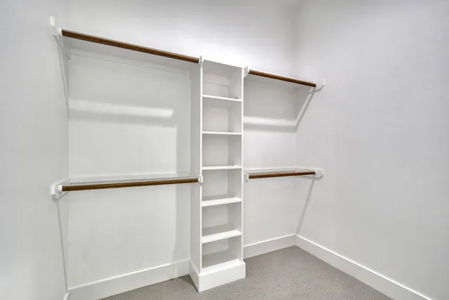 a view of an empty walk in closet