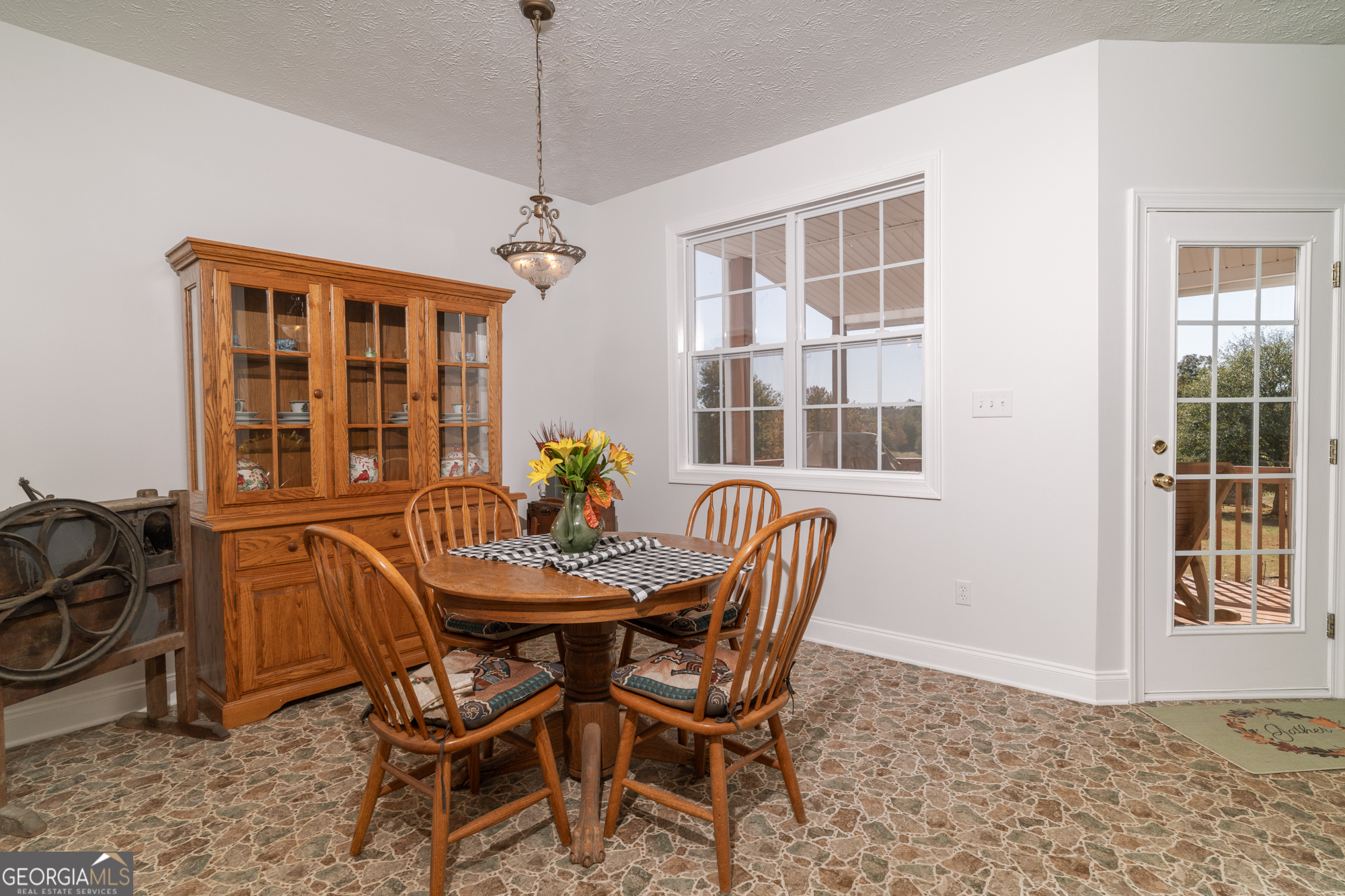 724 Teamon Road Griffin, GA 30223 - Photo 30 of 50 a dining room with furniture a chandelier and wooden floor