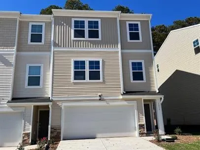a front view of a house with garage