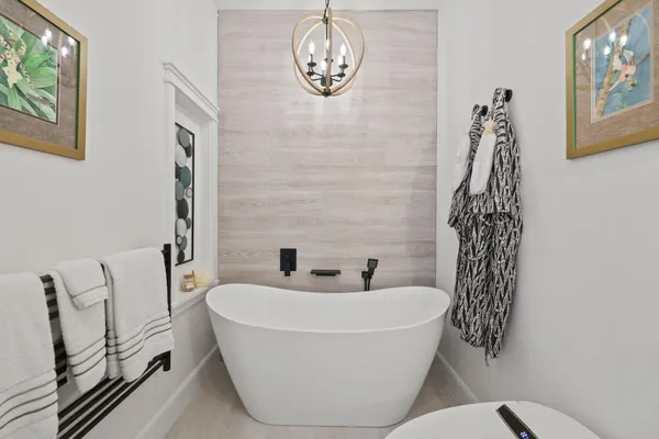 a bathroom with a bathtub and window