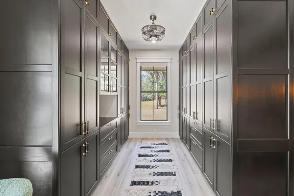 view of a refrigerator in kitchen and wooden floor