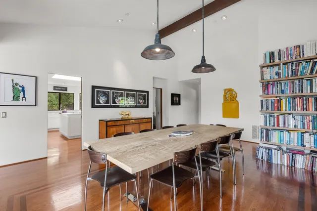 a bathroom with a toilet a sink and a mirror