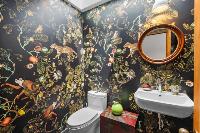 a kitchen with a sink and a stove top oven