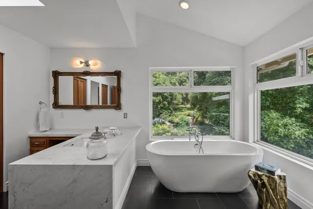 a bed room with a bed and a chair