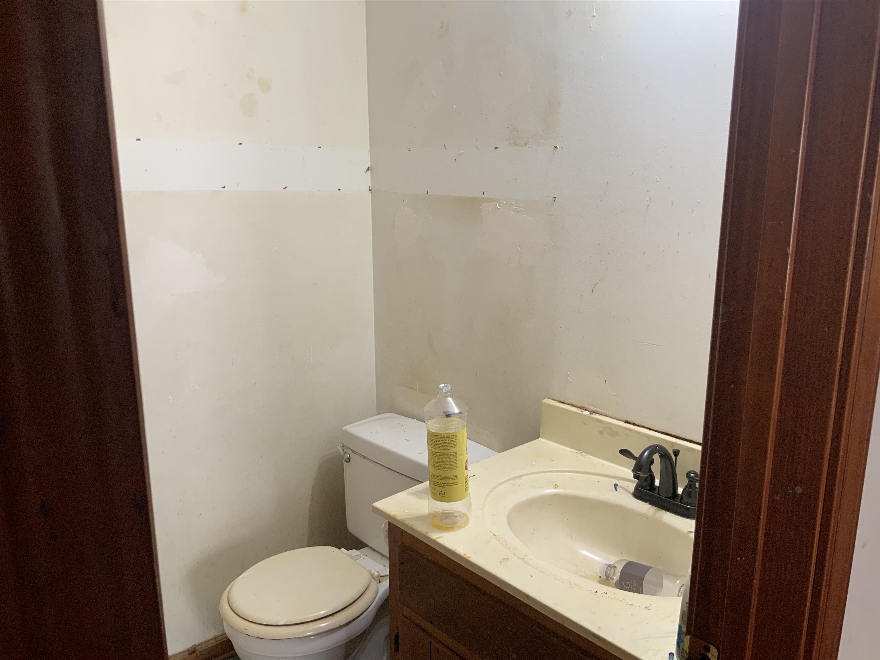 1860 Highway 59 Covington, TN 38019 - Photo 11 of 32 a white toilet sitting next to a bathroom sink