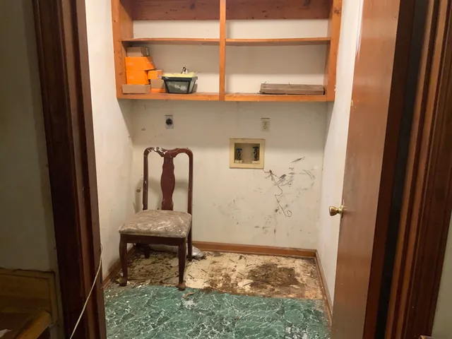 a white toilet sitting next to a small sink