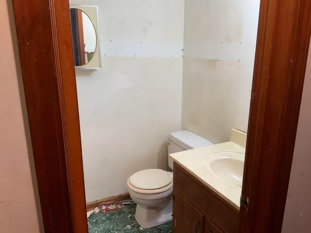 a kitchen with a stove and a refrigerator