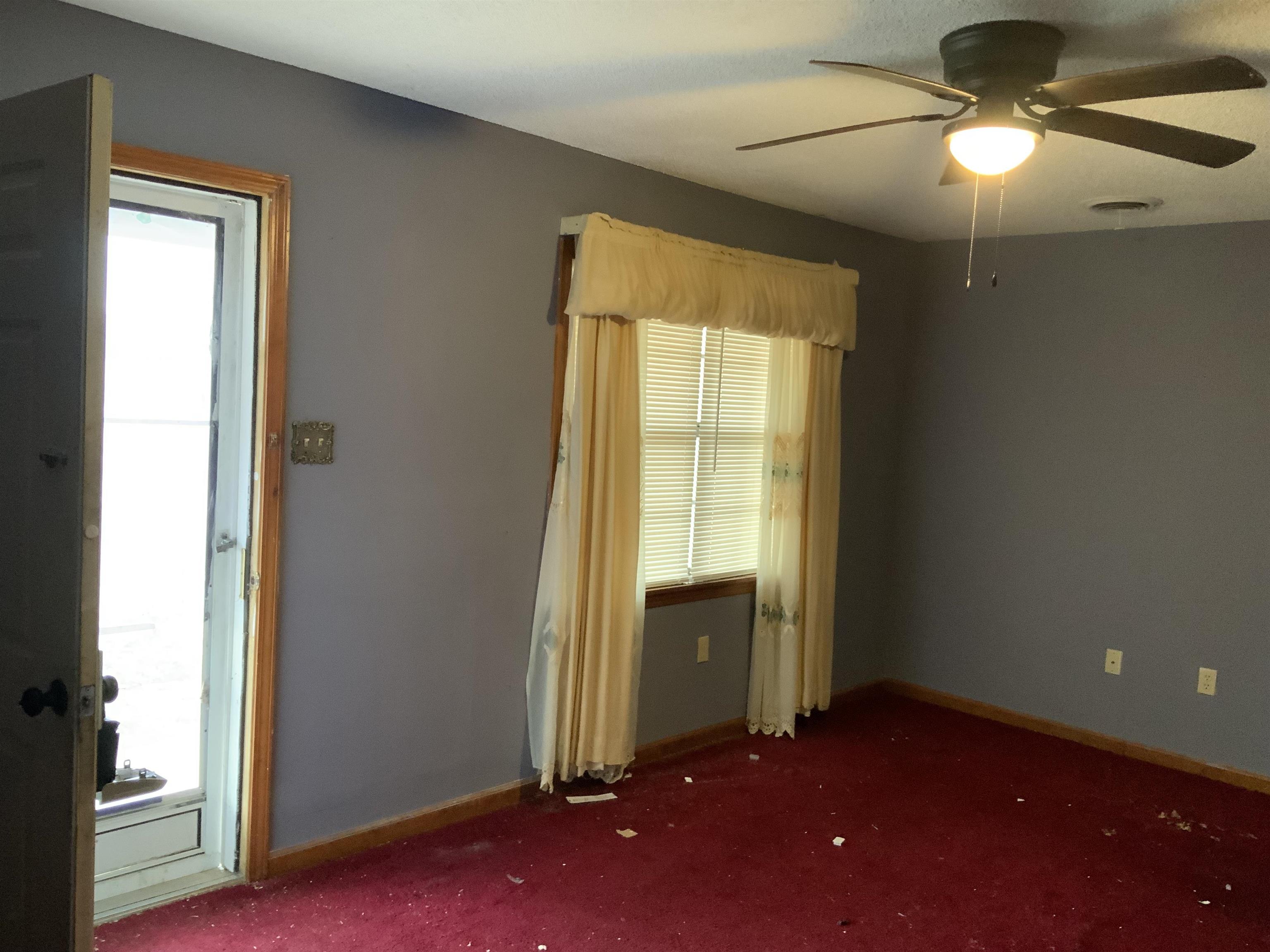 1860 Highway 59 Covington, TN 38019 - Photo 3 of 32 a view of an empty room with a window