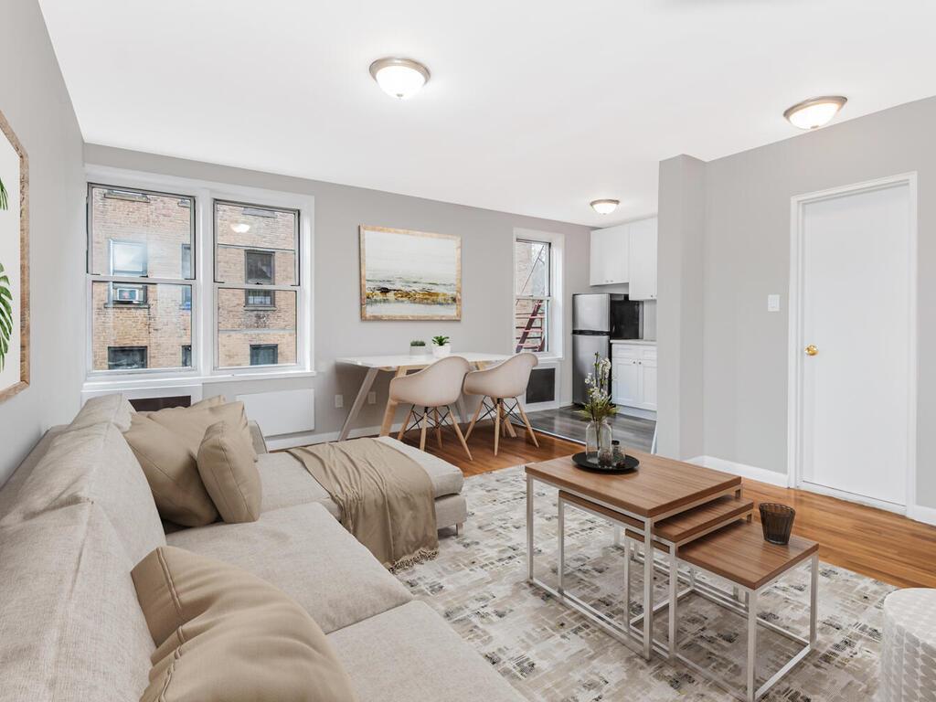 6535 Broadway, Unit 4B Bronx, NY 10471 - Photo 4 of 11 Living room featuring light wood-style floors and baseboards