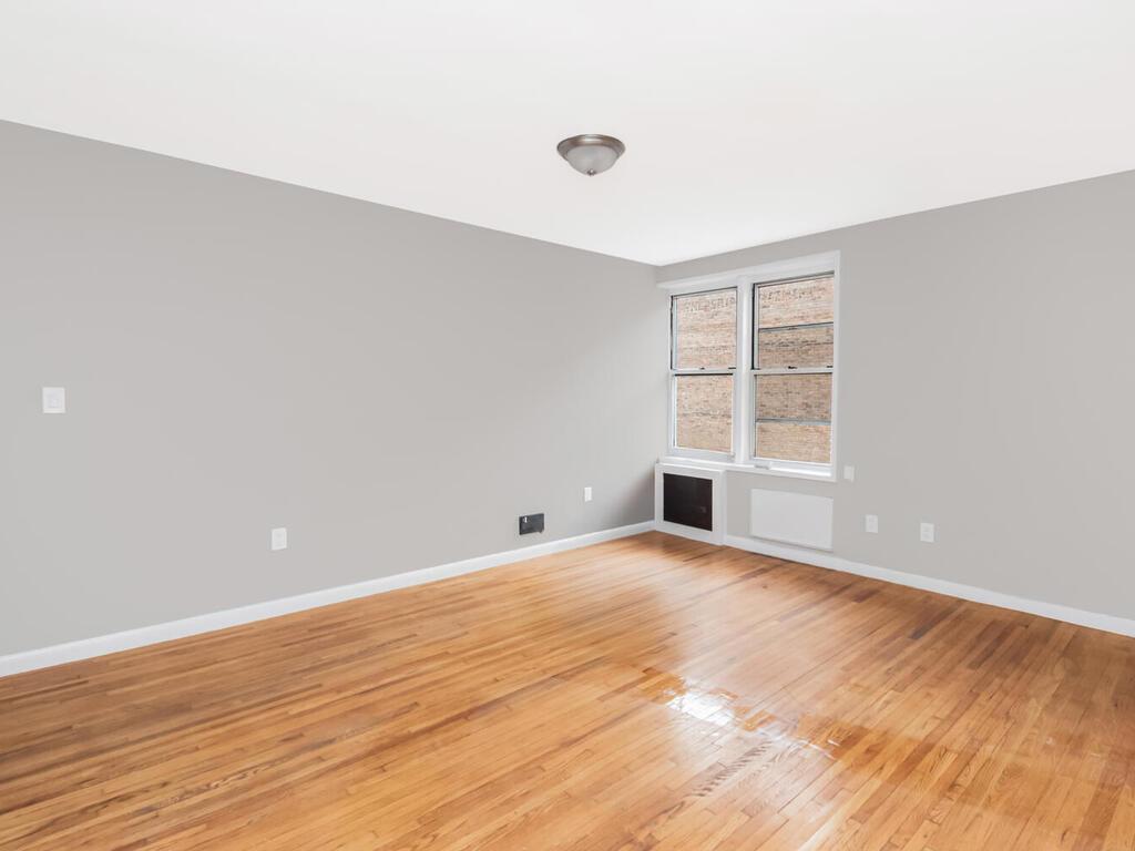 6535 Broadway, Unit 4B Bronx, NY 10471 - Photo 9 of 11 Empty room with baseboards and light wood finished floors