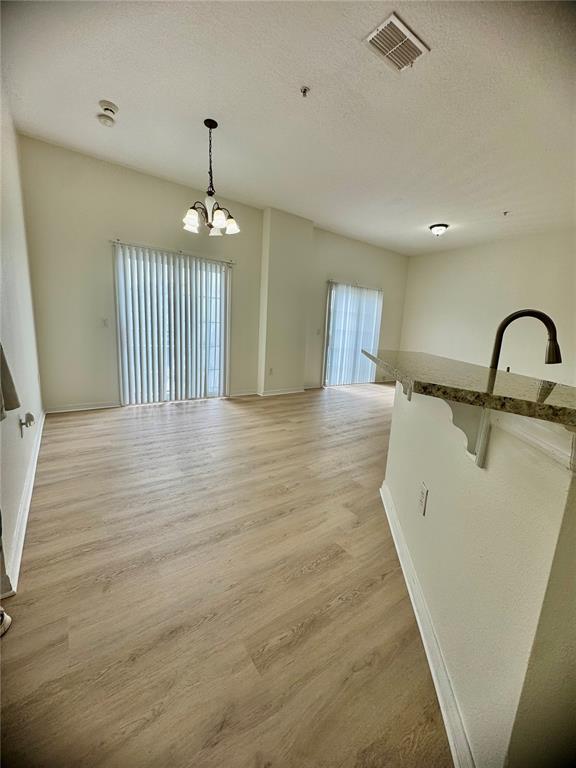 6404 South Goldenrod Road, Unit 2A Orlando, FL 32822 - Photo 8 of 40 a view of a kitchen with a sink and dishwasher
