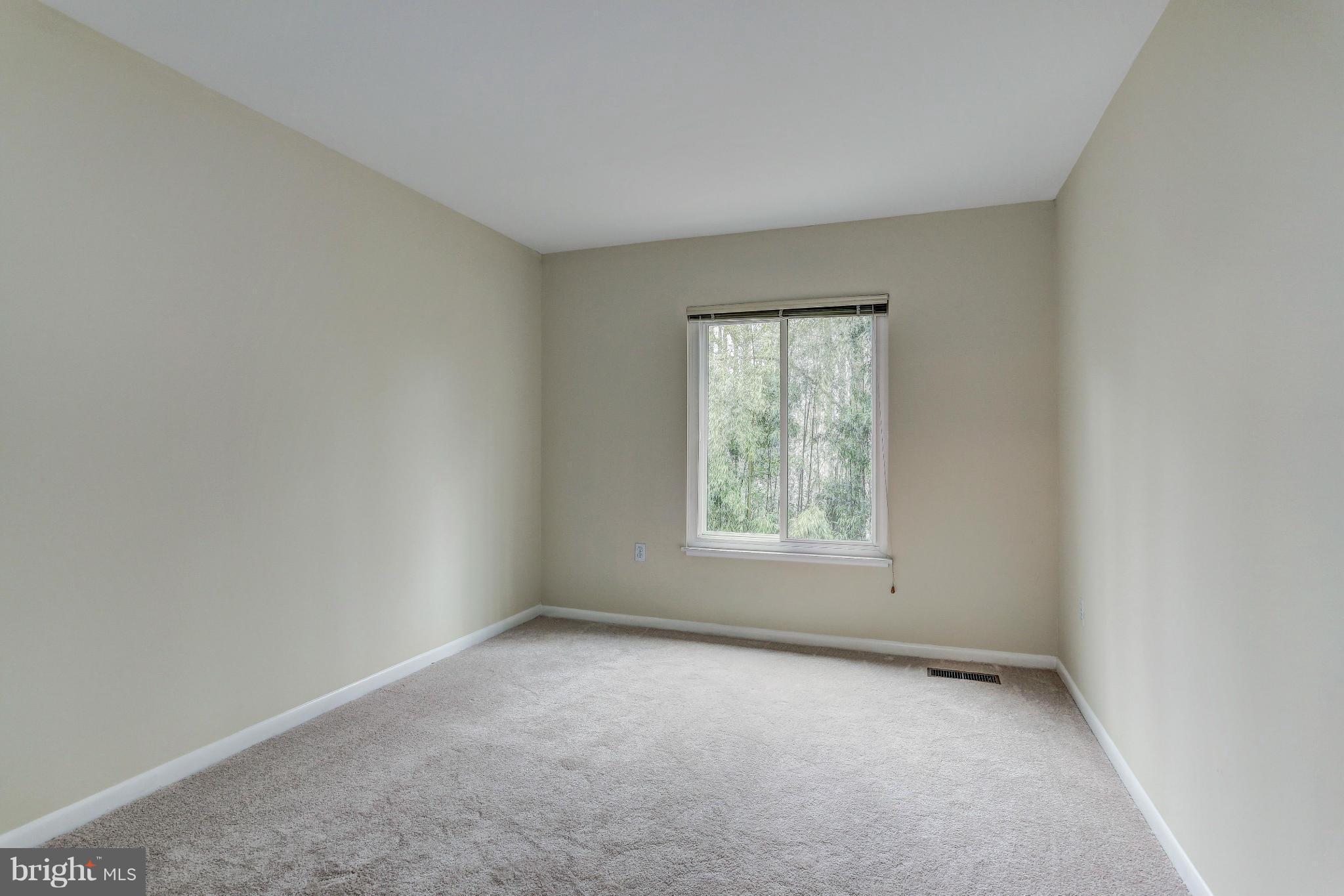 11522 Hearthstone Court Reston, VA 20191 - Photo 19 of 27 Comfortable second bedroom overlooks trees