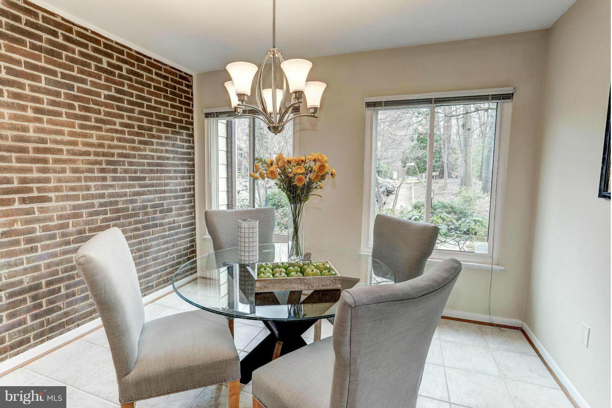 11522 Hearthstone Court Reston, VA 20191 - Photo 9 of 27 Dining room w/ charming brick accent wall