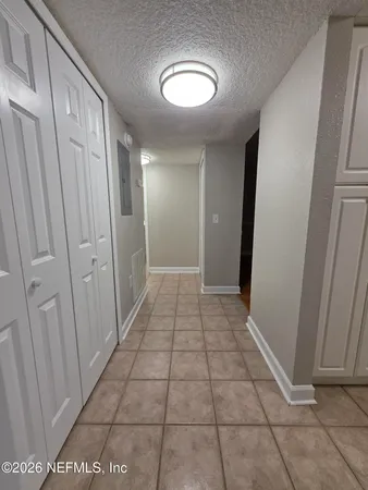 a large kitchen with kitchen island a sink dishwasher a stove and a refrigerator with wooden floor