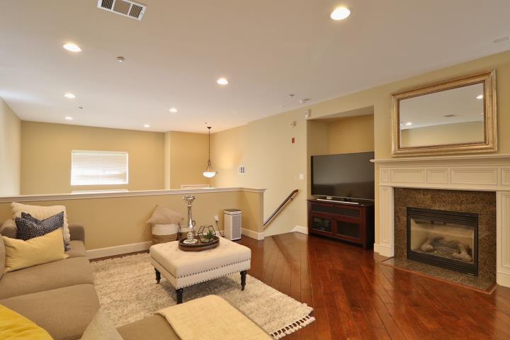 6372 Byron Lane San Ramon, CA 94582 - Photo 13 of 53 a living room with furniture flat screen tv and fireplace