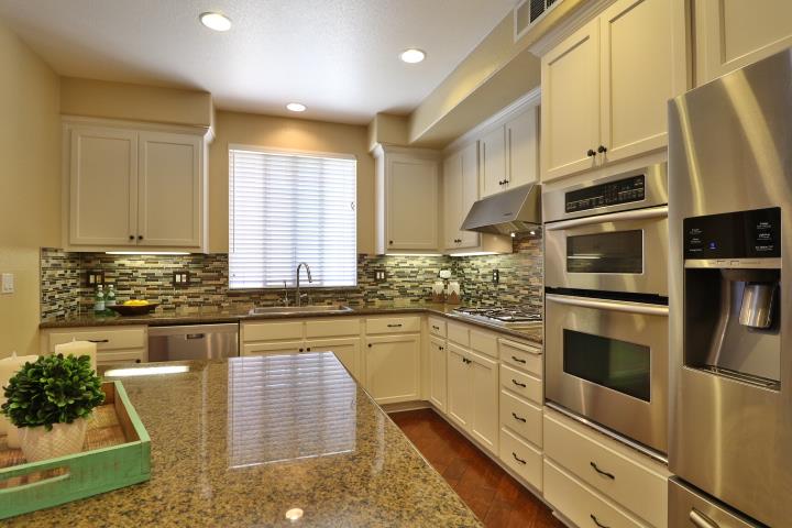 6372 Byron Lane San Ramon, CA 94582 - Photo 20 of 53 a kitchen with stainless steel appliances granite countertop a stove a sink and a microwave