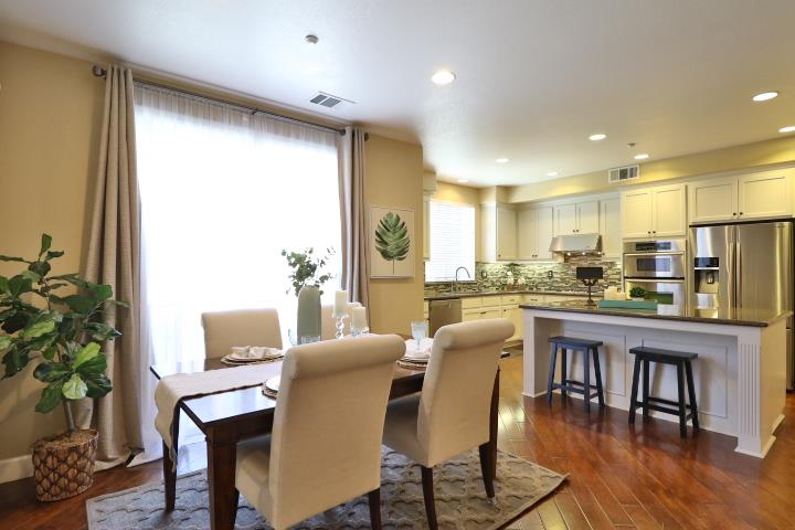 6372 Byron Lane San Ramon, CA 94582 - Photo 25 of 53 a dining room with furniture a window and wooden floor