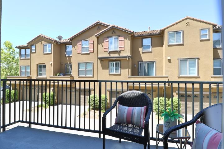 6372 Byron Lane San Ramon, CA 94582 - Photo 27 of 53 a view of a brick house with large windows and wooden fence