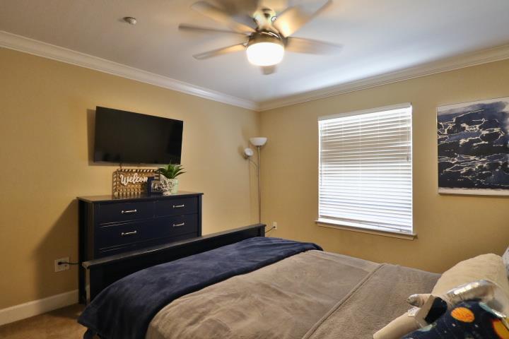 6372 Byron Lane San Ramon, CA 94582 - Photo 44 of 53 a bedroom with a bed and a flat screen tv