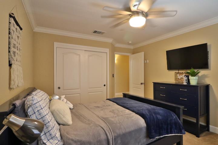 6372 Byron Lane San Ramon, CA 94582 - Photo 46 of 53 a bedroom with a bed and a flat screen tv