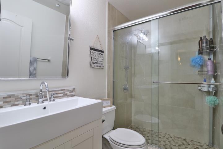 6372 Byron Lane San Ramon, CA 94582 - Photo 47 of 53 a bathroom with a sink mirror shower and toilet