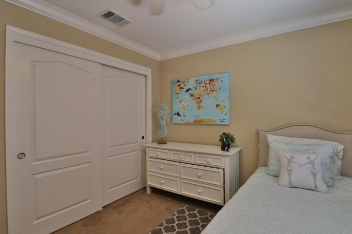 6372 Byron Lane San Ramon, CA 94582 - Photo 49 of 53 a bedroom with a bed and paintings on the wall
