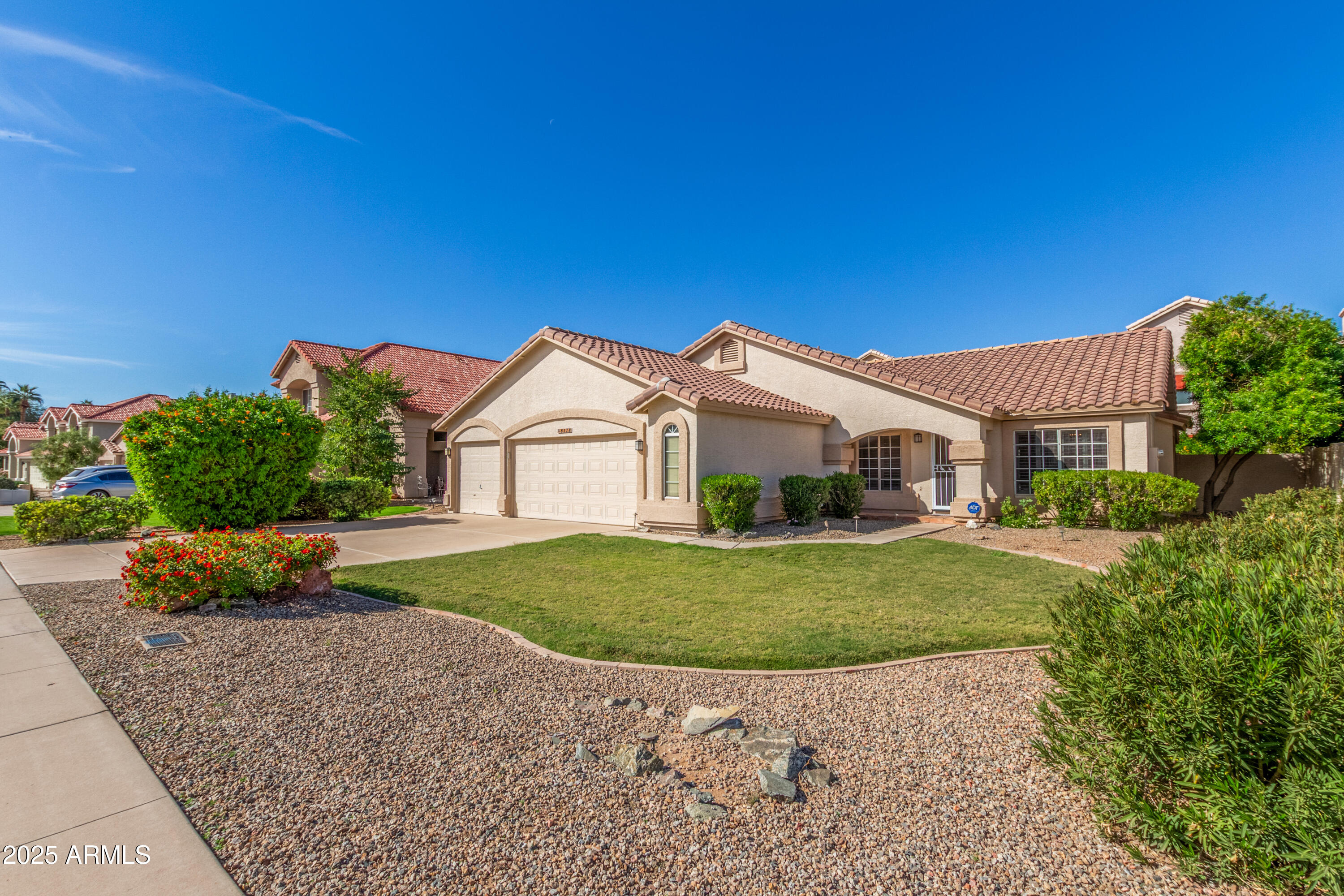8578 South Maple Avenue Tempe, AZ 85284 - Photo 2 of 28 a front view of a house with a yard