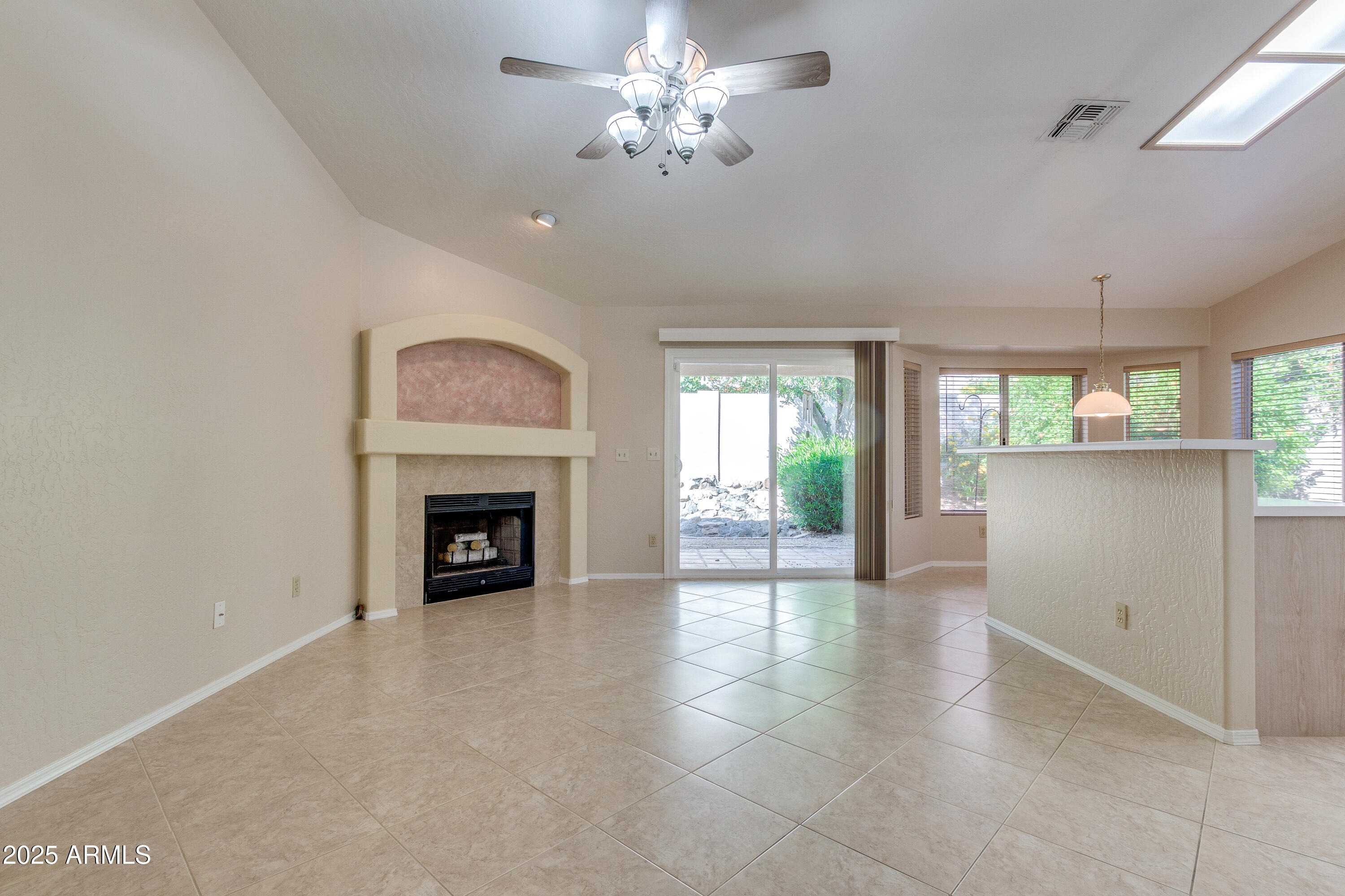 8578 South Maple Avenue Tempe, AZ 85284 - Photo 7 of 28 a view of a livingroom with a fireplace and window