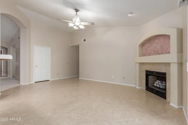 a view of an empty room with a fireplace