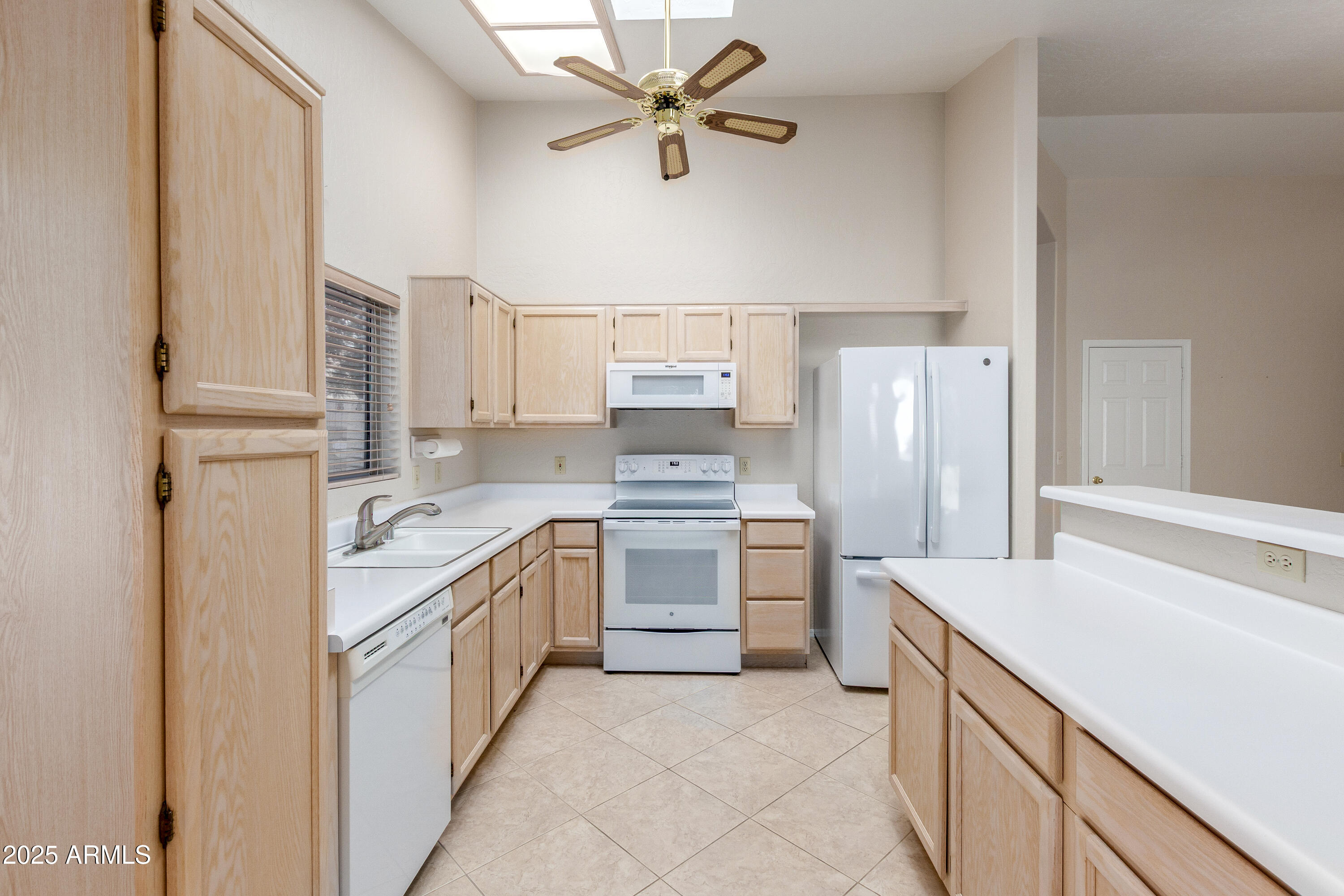 8578 South Maple Avenue Tempe, AZ 85284 - Photo 10 of 28 a kitchen with a sink stove and refrigerator