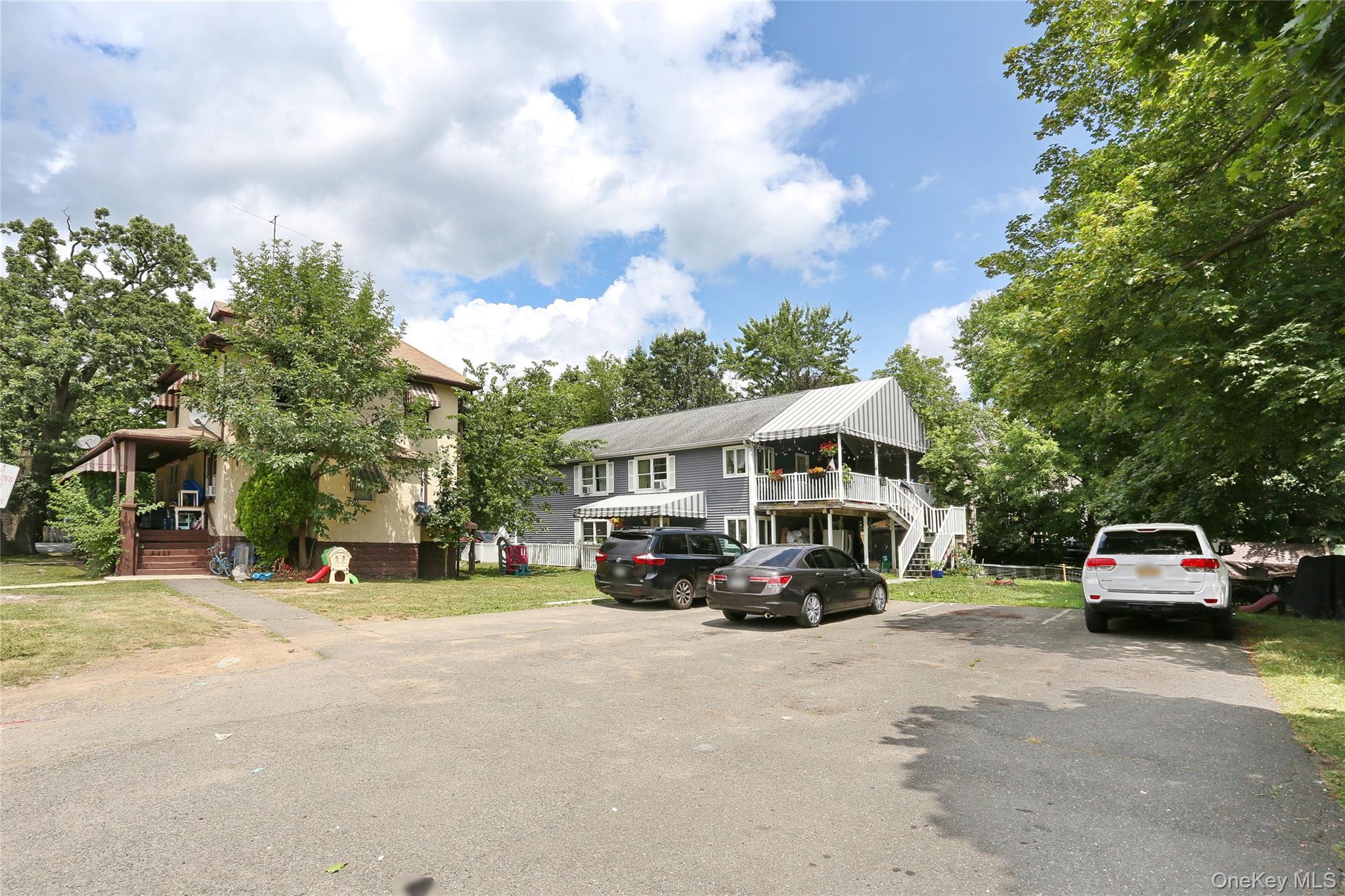 Undisclosed Address Spring Valley, NY 10977 - Photo 3 of 9 a car parked in front of a house