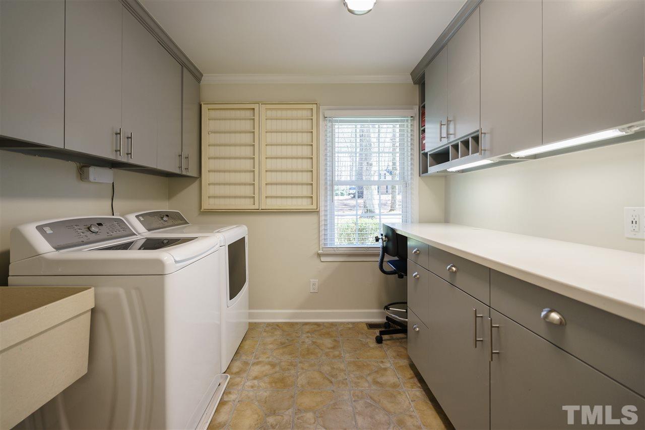 1006 Queensferry Road Cary, NC 27511 - Photo 14 of 25 Large laundry room with abundant storage!