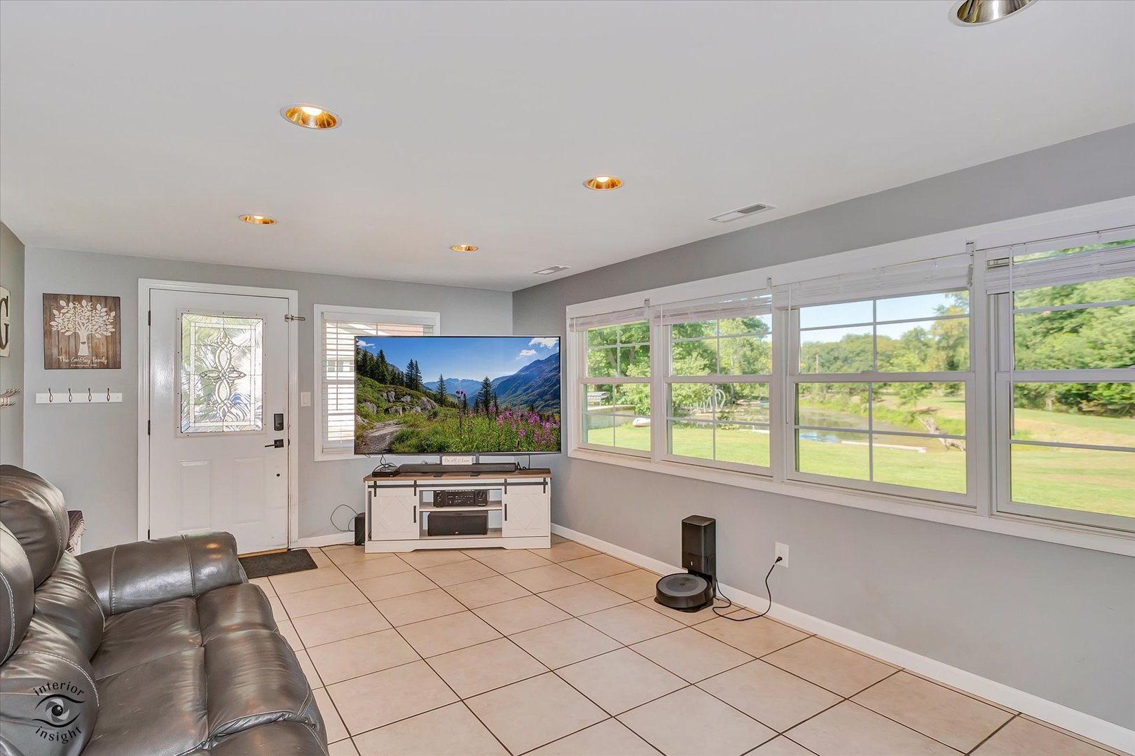 4248 South Youth Camp Road St. Anne, IL 60964 - Photo 11 of 36 a living room with furniture tv and a window
