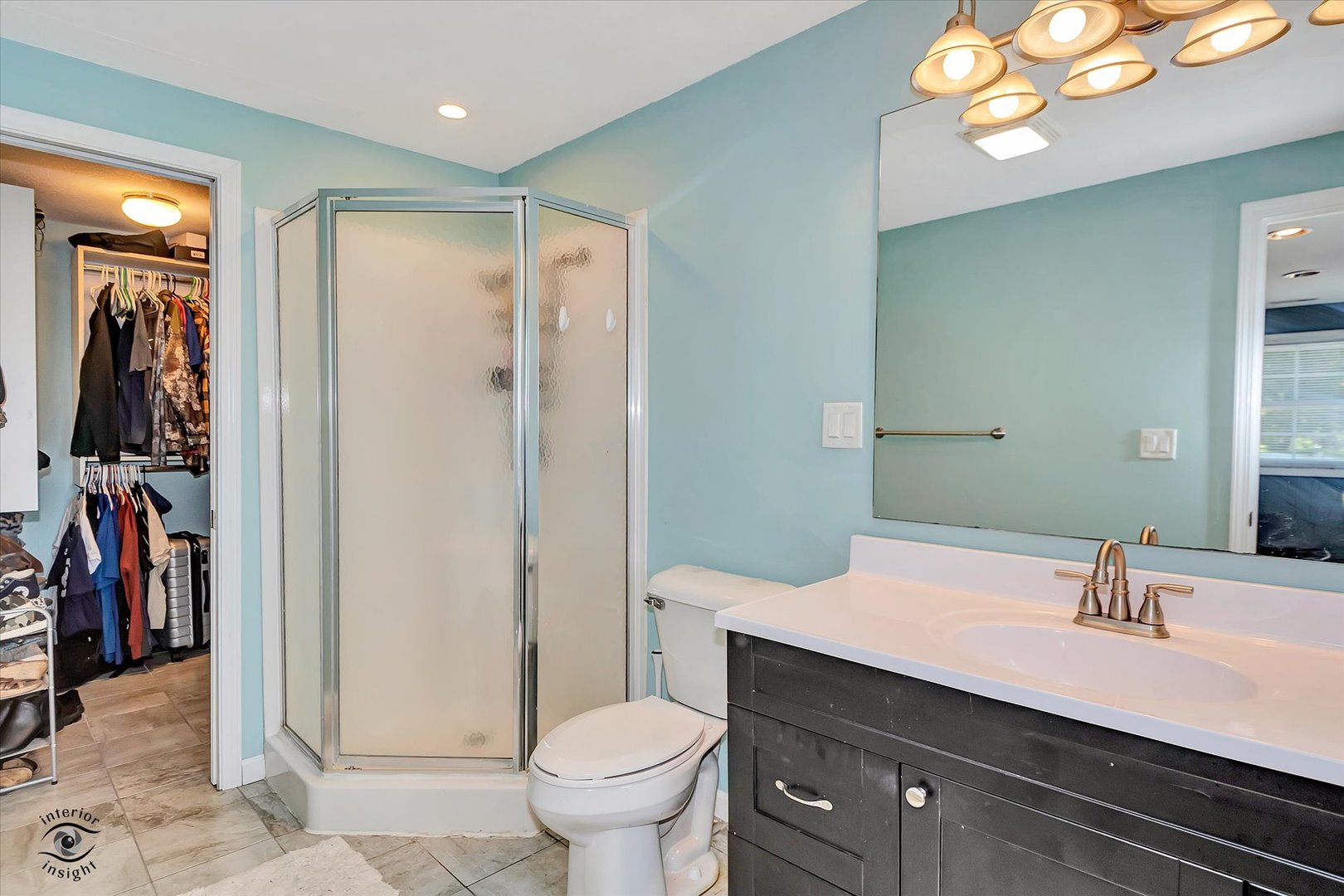 4248 South Youth Camp Road St. Anne, IL 60964 - Photo 15 of 36 a bathroom with a sink a toilet and a large mirror