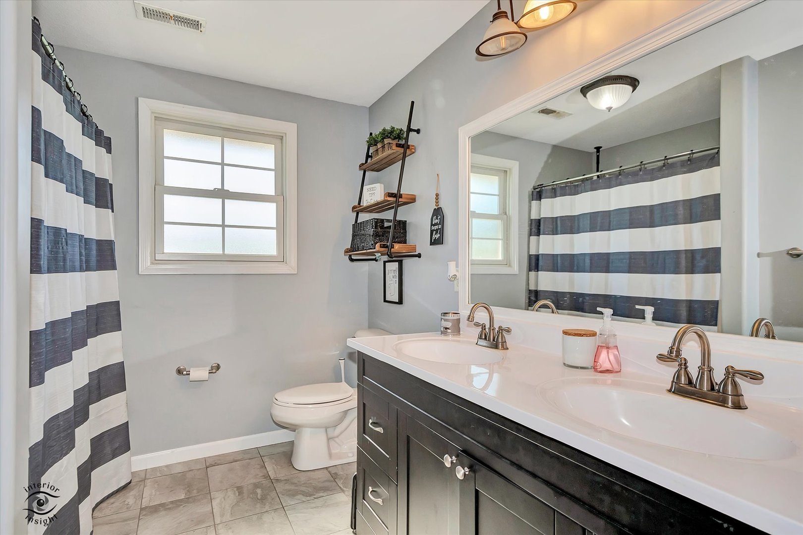 4248 South Youth Camp Road St. Anne, IL 60964 - Photo 18 of 36 a bathroom with a double vanity sink toilet and shower