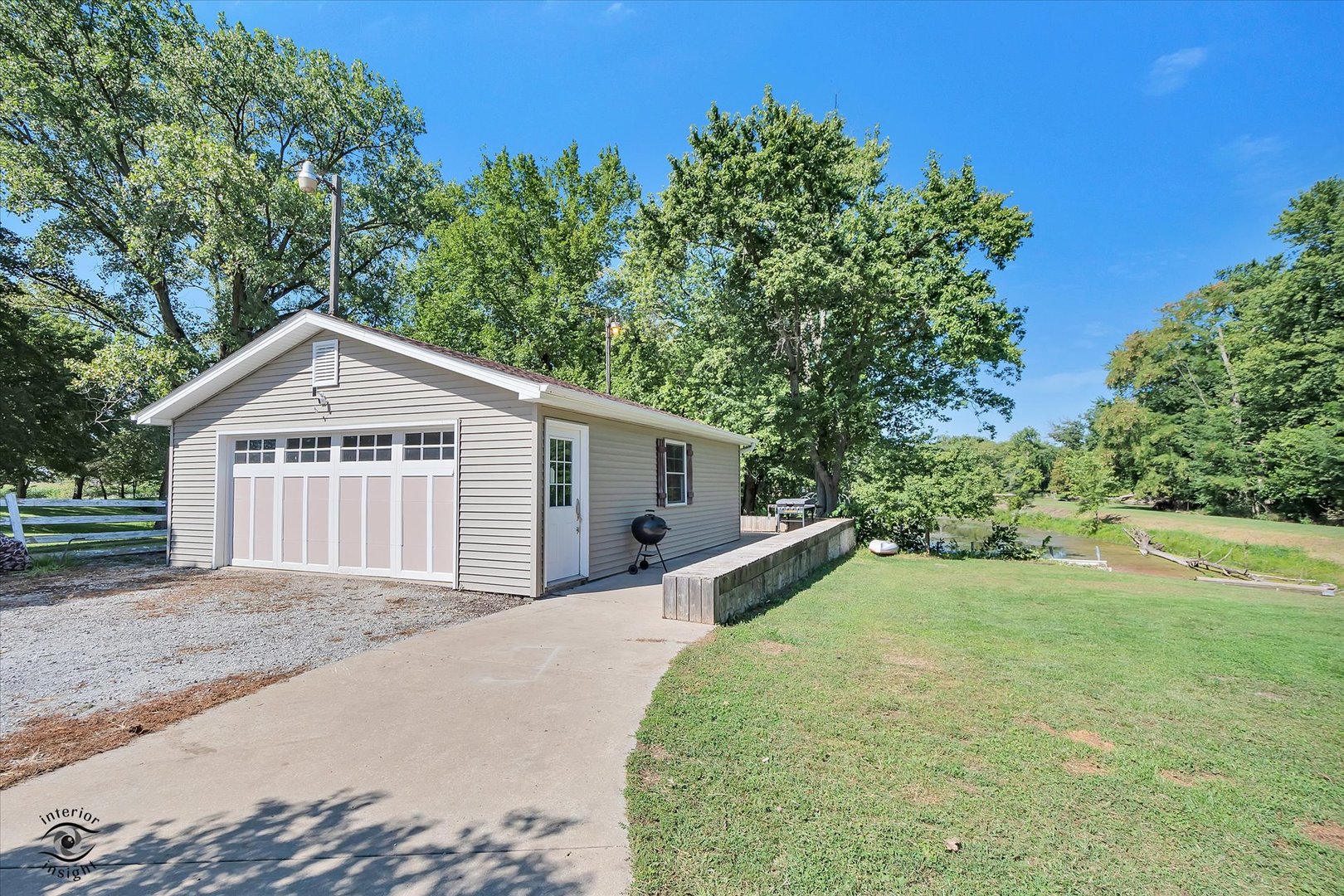 4248 South Youth Camp Road St. Anne, IL 60964 - Photo 20 of 36 a view of a house with a yard and large trees