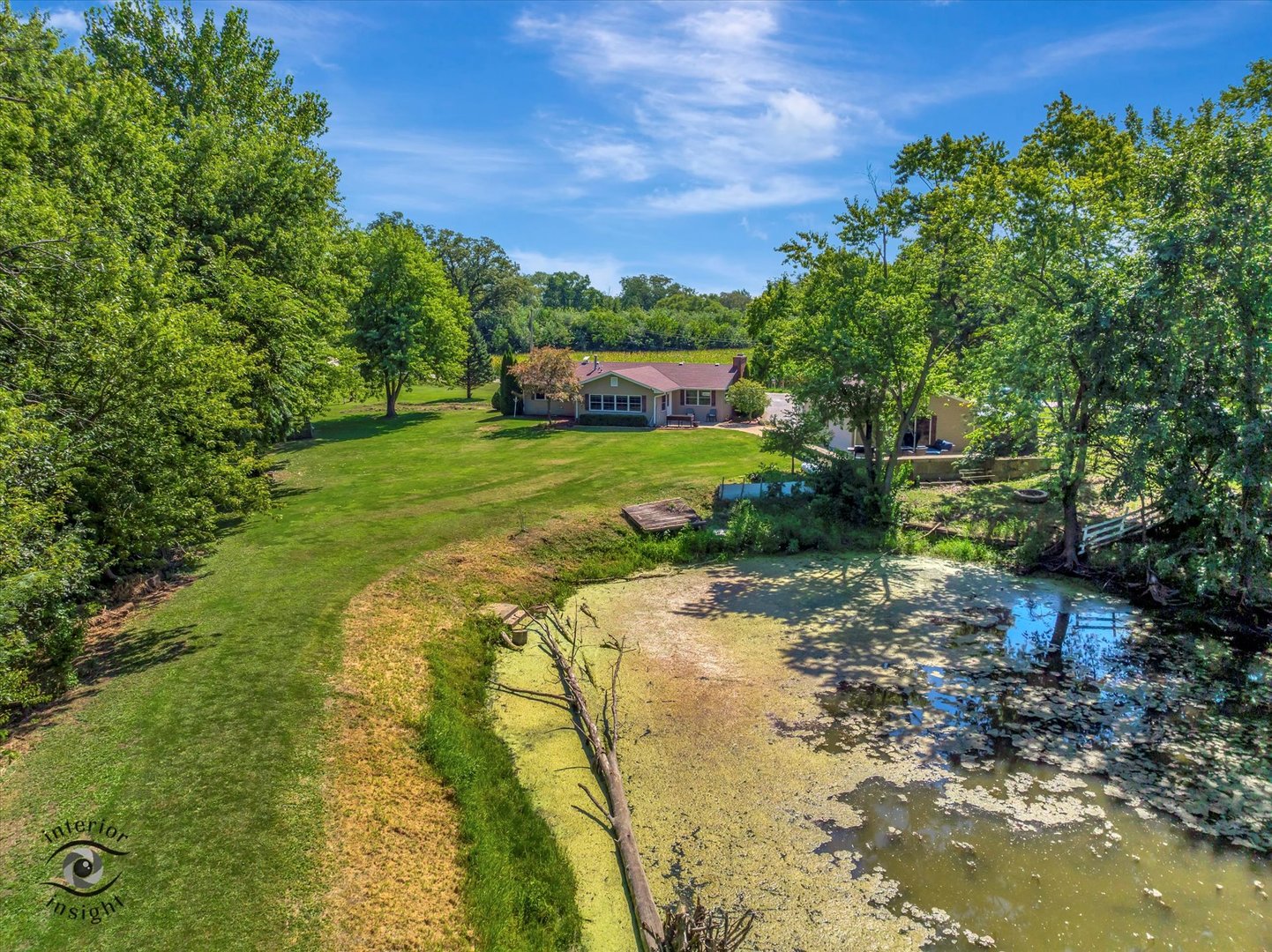 4248 South Youth Camp Road St. Anne, IL 60964 - Photo 33 of 36 a view of a yard with plants and a bench