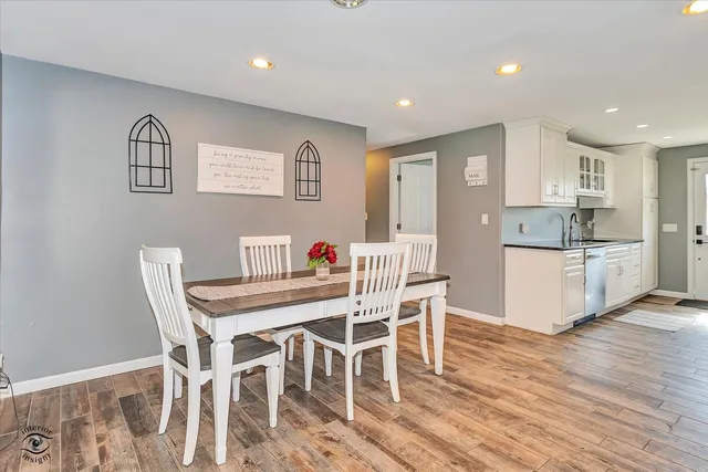 a view of a dining room with furniture and wooden floor