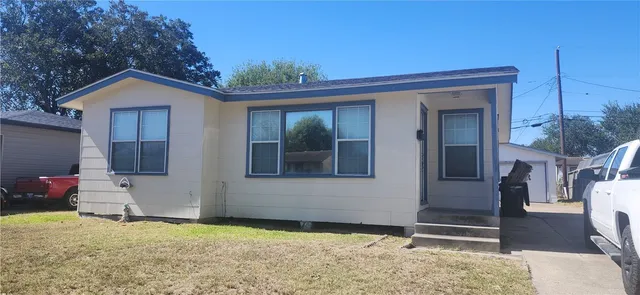 a house view with a backyard space