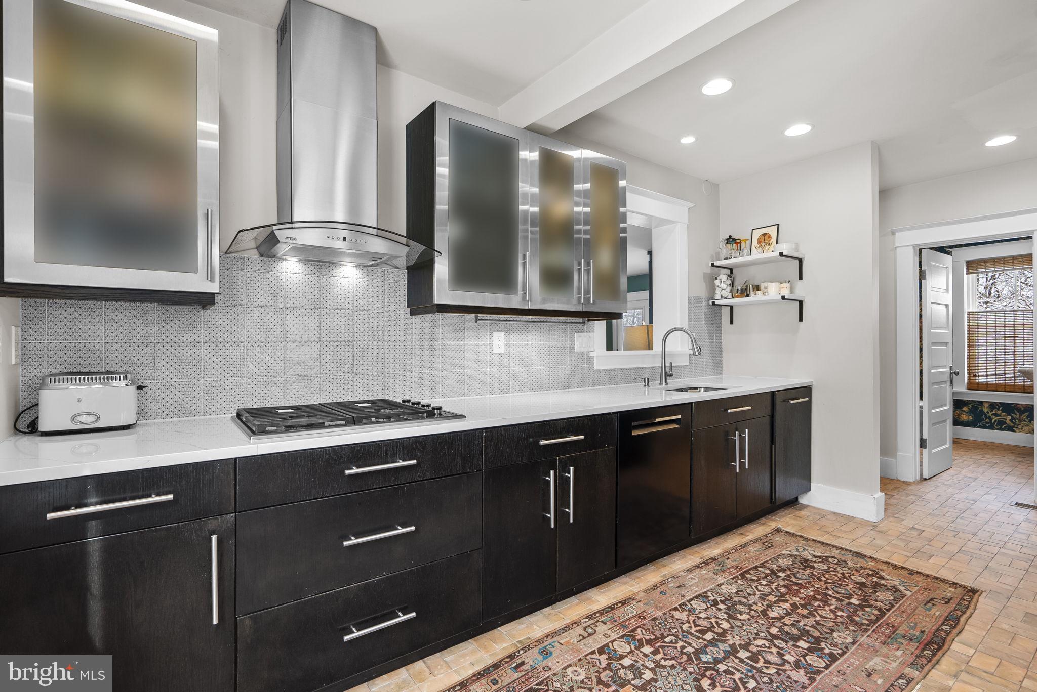 1415 Ballard Street Silver Spring, MD 20910 - Photo 13 of 56 a kitchen with a sink and cabinets