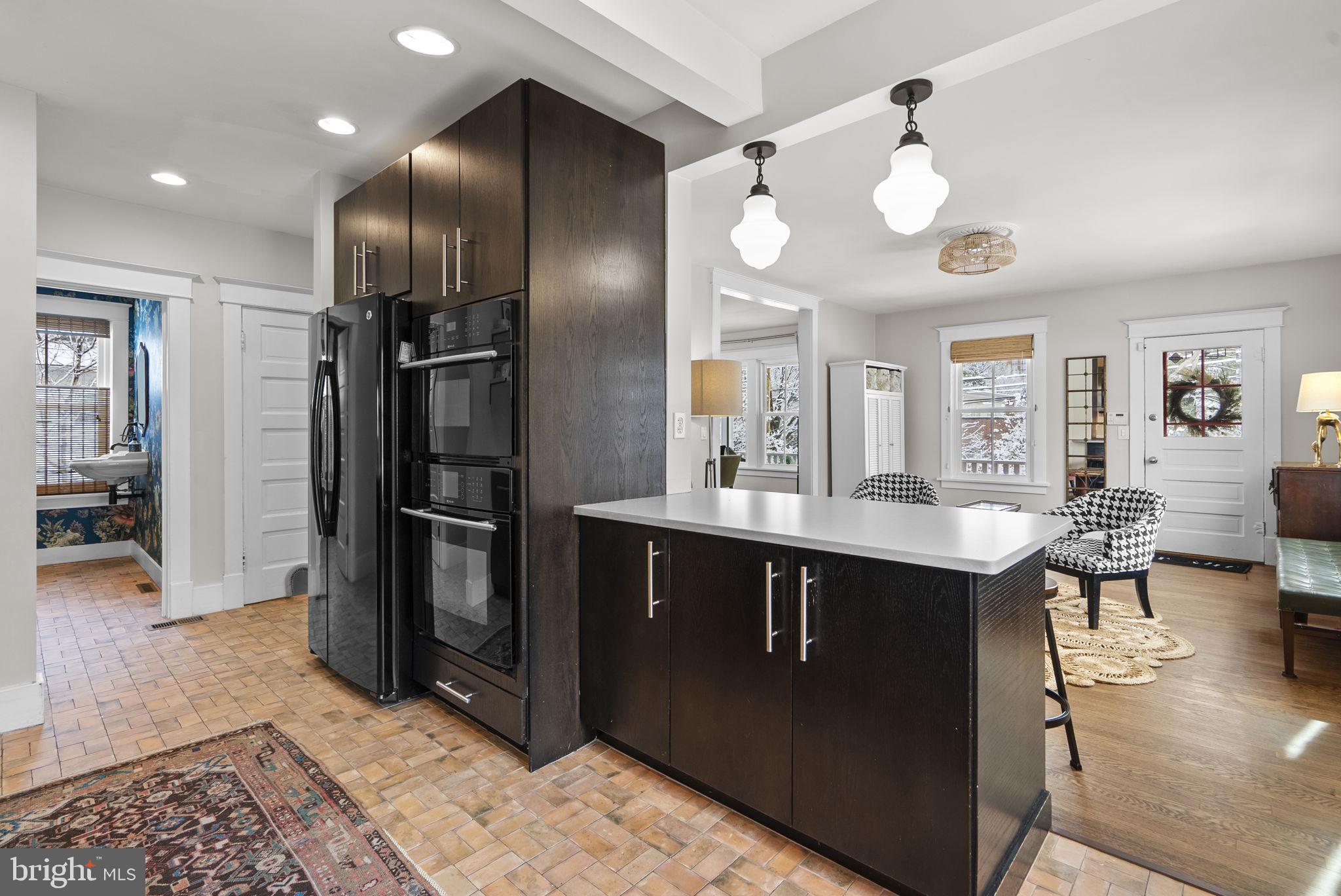1415 Ballard Street Silver Spring, MD 20910 - Photo 14 of 56 a kitchen with stainless steel appliances granite countertop a sink and a refrigerator