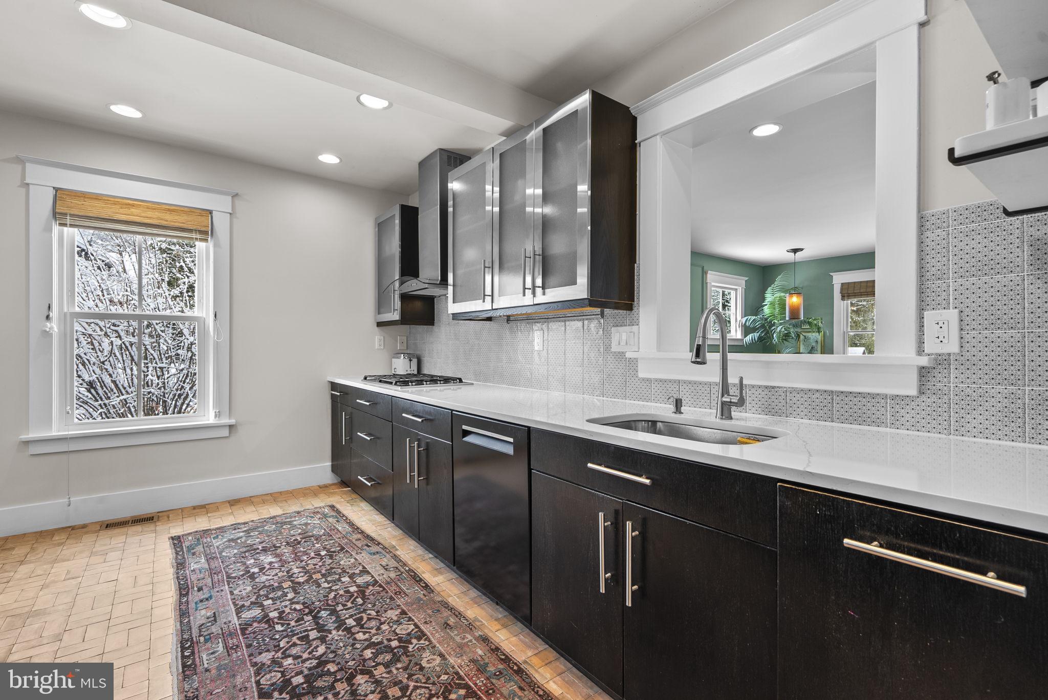 1415 Ballard Street Silver Spring, MD 20910 - Photo 15 of 56 a kitchen with a sink stove and cabinets