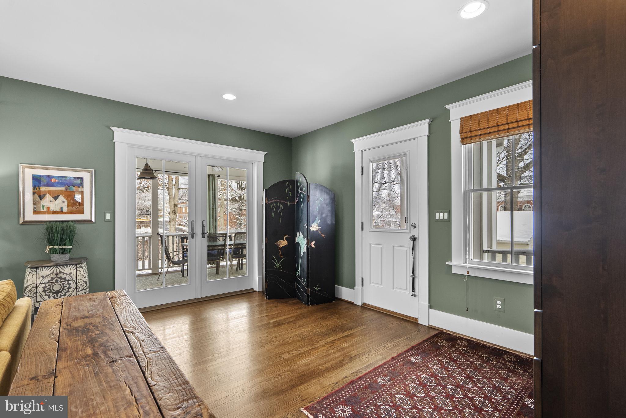 1415 Ballard Street Silver Spring, MD 20910 - Photo 19 of 56 a view of a hallway with wooden floor and windows
