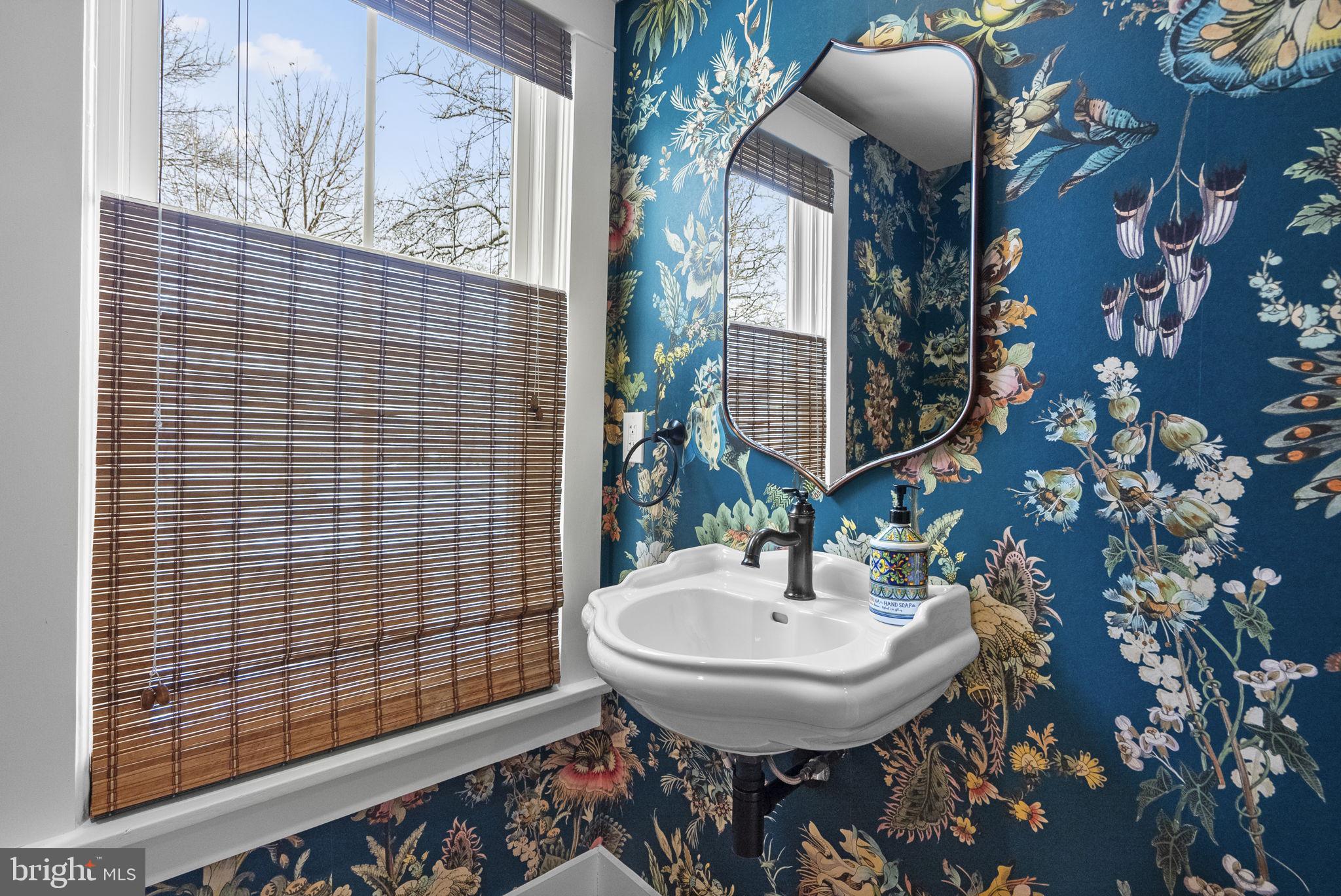 1415 Ballard Street Silver Spring, MD 20910 - Photo 25 of 56 a bathroom with a sink a mirror and a toilet