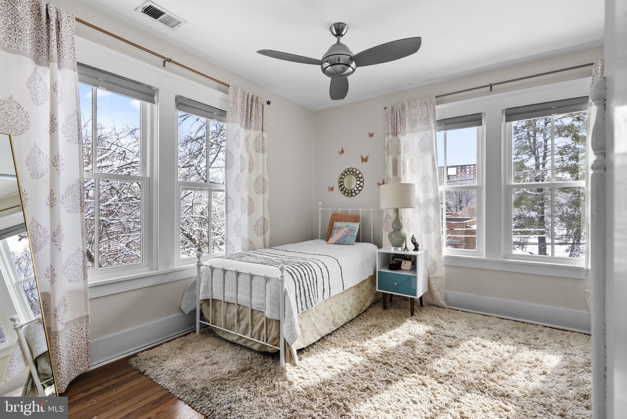 1415 Ballard Street Silver Spring, MD 20910 - Photo 28 of 56 a spacious bedroom with a large bed and a window
