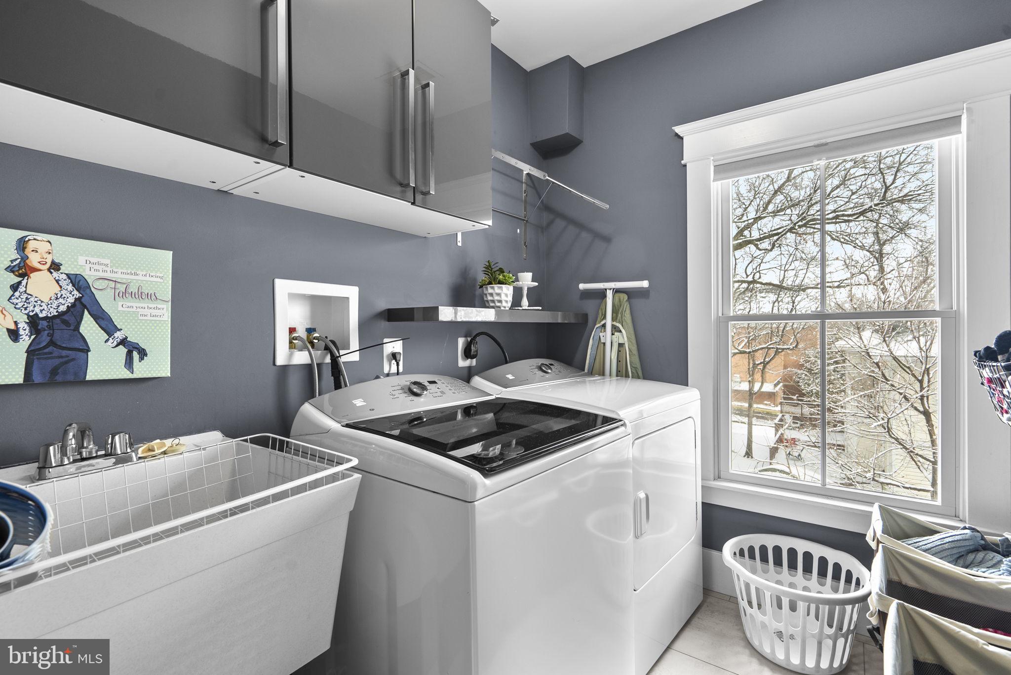 1415 Ballard Street Silver Spring, MD 20910 - Photo 35 of 56 a kitchen that has a sink a stove and a table in it